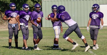 Lemoore High football players working out Tuesday afternoon.